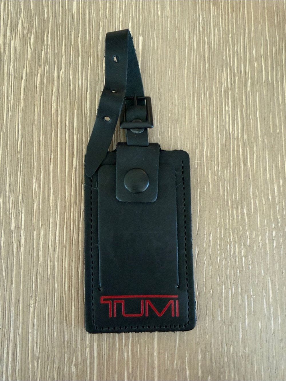 Black Tumi Luggage tag